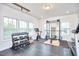 Home gym featuring weights, exercise equipment, and rubber flooring at 112 Filigree Way, Durham, NC 27713