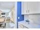 Open hallway with views of the dining room, living room, and kitchen at 112 Filigree Way, Durham, NC 27713
