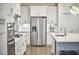 Modern kitchen boasts stainless steel appliances and an island with a countertop at 112 Filigree Way, Durham, NC 27713