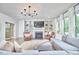 Spacious living room with fireplace, built-in shelves, and plush seating at 112 Filigree Way, Durham, NC 27713