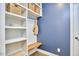 Mudroom featuring custom built-ins, hooks, seating and storage for organization at 112 Filigree Way, Durham, NC 27713