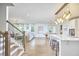 Spacious open floor plan with hardwood floors connecting the kitchen, dining, and living areas at 112 Filigree Way, Durham, NC 27713
