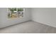Bedroom with gray carpet and a view of the neighborhood at 1201 Solace Way, Rolesville, NC 27571