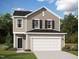 Inviting two-story home with a neutral color scheme, black shutters, and a two car garage at 1201 Solace Way, Rolesville, NC 27571