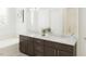 Bright bathroom featuring double sinks, quartz countertops, and modern fixtures at 1205 Masters Place Way # 183, Durham, NC 27703