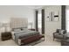 Comfortable bedroom featuring a padded headboard, side tables with lamps, and decor accents at 1205 Masters Place Way # 183, Durham, NC 27703