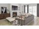 Bright living room with fireplace, wood floors, comfortable seating, and natural light at 1205 Masters Place Way # 183, Durham, NC 27703