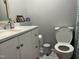 Bathroom features white cabinets, modern sink, and grey walls and fixtures at 122 Button Rd, Morrisville, NC 27560