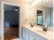 Bathroom featuring a double vanity, bathtub, and access to the bedroom at 122 Button Rd, Morrisville, NC 27560