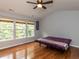 Bright bedroom with three windows and hardwood floors at 122 Button Rd, Morrisville, NC 27560