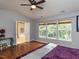 Comfortable bedroom with hardwood floors, ample natural light and ensuite bathroom at 122 Button Rd, Morrisville, NC 27560