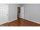 Clean, simple bedroom with hardwood floors at 122 Button Rd, Morrisville, NC 27560