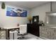 Home office offers lots of light with white walls, stylish decor, a white rolling chair and a desk at 122 Button Rd, Morrisville, NC 27560