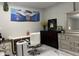 Home office offers decor, a wooden dresser, a modern desk and chair and modern wall art at 122 Button Rd, Morrisville, NC 27560
