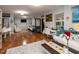 Spacious living room with hardwood floors, lots of seating, natural light, and stylish decor at 122 Button Rd, Morrisville, NC 27560