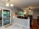 Inviting living room with a fireplace, comfortable seating, and a seamless flow from the sunroom at 122 Button Rd, Morrisville, NC 27560