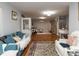 Open living room design offering hardwood floors, stylish furnishings, and natural light at 122 Button Rd, Morrisville, NC 27560