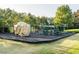 Community playground area featuring climbing rock structure and numerous bars and play equipment at 122 Button Rd, Morrisville, NC 27560