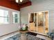 Cozy sunroom with marble floors, ample windows and sliding glass door to the interior at 122 Button Rd, Morrisville, NC 27560