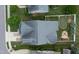 Aerial view of backyard with putting green, playset, and firepit at 13 Nettletree Creek Ct, Youngsville, NC 27596