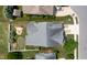 Aerial view of home with putting green, firepit, and playset in landscaped backyard at 13 Nettletree Creek Ct, Youngsville, NC 27596