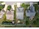 Aerial view of home with fenced yard, putting green, playset, and firepit at 13 Nettletree Creek Ct, Youngsville, NC 27596