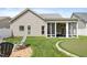 This home offers a spacious backyard featuring a putting green, perfect for enjoying outdoor activities at 13 Nettletree Creek Ct, Youngsville, NC 27596