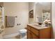 Bathroom with a pedestal sink and framed mirror and a curtained shower/tub combo on the left at 13 Nettletree Creek Ct, Youngsville, NC 27596
