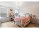 Elegant bedroom with a crystal chandelier, a vanity and a hanging swing chair at 13 Nettletree Creek Ct, Youngsville, NC 27596