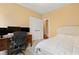 Bedroom with a workspace, a double door closet, and upholstered headboard at 13 Nettletree Creek Ct, Youngsville, NC 27596