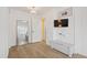 Clean bedroom with a full length mirror and view into the next room at 13 Nettletree Creek Ct, Youngsville, NC 27596