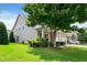 Traditional-style home with a covered porch, stone accents, and a well-maintained front yard at 13 Nettletree Creek Ct, Youngsville, NC 27596