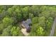 Aerial view of the home nestled among trees, highlighting its private setting at 13121 Melvin Arnold Rd, Raleigh, NC 27613