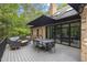 Spacious outdoor deck with dining and seating areas, perfect for entertaining with backyard views at 13121 Melvin Arnold Rd, Raleigh, NC 27613