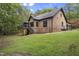 Beautiful brick home exterior with a well-maintained yard and wooded surroundings at 13121 Melvin Arnold Rd, Raleigh, NC 27613