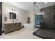 Elegant bathroom featuring a freestanding tub, glass shower, modern vanity, and stylish fixtures at 13121 Melvin Arnold Rd, Raleigh, NC 27613