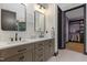 Modern bathroom with double vanity, updated fixtures, and a stylish design at 13121 Melvin Arnold Rd, Raleigh, NC 27613