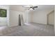 Open bedroom with carpet, a ceiling fan, a full length mirror, and natural light from a window at 13121 Melvin Arnold Rd, Raleigh, NC 27613
