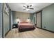 Cozy bedroom features a decorative accent wall, sliding barn door, and soft, inviting colors at 13121 Melvin Arnold Rd, Raleigh, NC 27613
