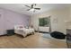 Charming bedroom featuring hardwood floors, a window view, and decorative details at 13121 Melvin Arnold Rd, Raleigh, NC 27613