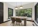 Bright dining room with a large window, offering scenic views and a cozy atmosphere at 13121 Melvin Arnold Rd, Raleigh, NC 27613