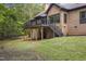 Back exterior of home with raised deck and stairs at 13121 Melvin Arnold Rd, Raleigh, NC 27613