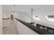 Bright upstairs hallway with skylights and views of the outdoor deck at 13121 Melvin Arnold Rd, Raleigh, NC 27613