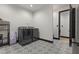 Well-appointed laundry room with patterned tile flooring and modern washer and dryer units at 13121 Melvin Arnold Rd, Raleigh, NC 27613