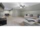Spacious living room with comfortable seating, neutral tones, and carpet flooring at 13121 Melvin Arnold Rd, Raleigh, NC 27613