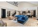 Open-concept living room with vaulted ceilings, modern furnishings, and a seamless flow into the kitchen at 13121 Melvin Arnold Rd, Raleigh, NC 27613