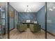 Well-appointed home office with sleek desk, green chairs, and stylish decor at 13121 Melvin Arnold Rd, Raleigh, NC 27613