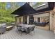 Charming deck with outdoor dining set and lounge area, perfect for entertaining or relaxing outdoors at 13121 Melvin Arnold Rd, Raleigh, NC 27613