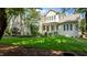 Expansive backyard featuring lush green lawn, mature trees, and a cozy outdoor seating area at 1420 Heritage Links Dr, Wake Forest, NC 27587