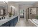 The bathroom features dual sinks, a large tub, and a separate shower with modern fixtures at 1420 Heritage Links Dr, Wake Forest, NC 27587